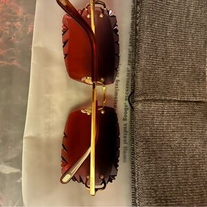 Gold and red cartier glasses